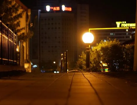 Sidewalk of the night city Stock Photos