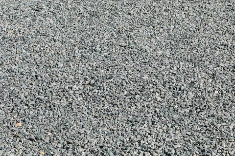 Sidewalk only with compacted crushed stone, in a regular and flat manner. Stock Photos