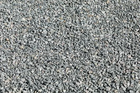 Sidewalk only with compacted crushed stone, in a regular and flat manner. Stock Photos