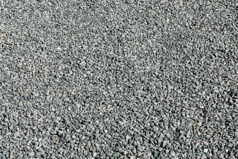 Sidewalk only with compacted crushed stone, in a regular and flat manner. Stock Photos