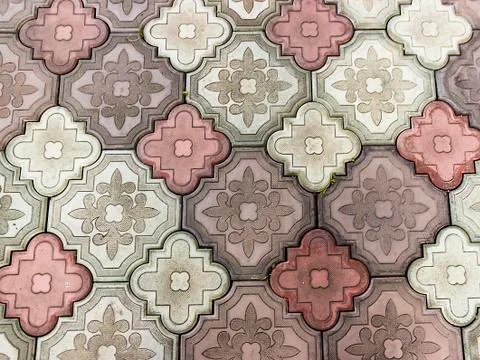 Sidewalk paved with rectangular red, white and gray tiles in perspective Stock Photos