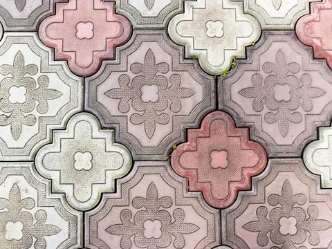 Sidewalk paved with rectangular red, white and gray tiles in perspective Stock Photos