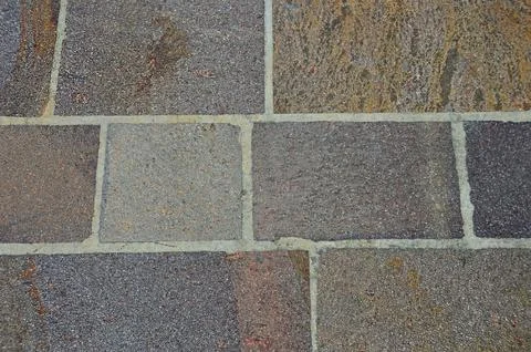The sidewalk is paved with stone tiles Stock Photos