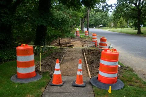 Sidewalk in the process of being replaced. Damaged concrete blocks have been  Stock Photos
