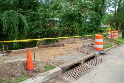 Sidewalk in the process of being replaced. Damaged concrete blocks have been  Stock Photos
