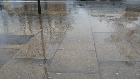 The sidewalk with rippled rain on puddles. Stock Footage 168616668