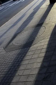 Sidewalk shadows Stock Photos