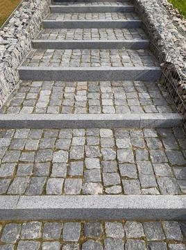 Sidewalk steps from paved tiled stone going into perspective with borders Stock Photos