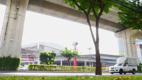 Sidewalks, trees, and roads with traffic in Thailand Stock Footage 262780733