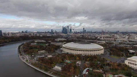 Sideward drone flight along river and stadium Stock Footage 322933480