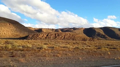 Sideway driving view desert road on route 95, on a november evening, in Nev.. Stock Footage 72421130