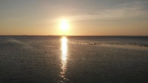Sideway shot over ocean at sunset in tropical Karimunjawa Stock Footage 121502413