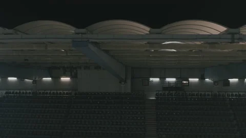 Sideway travel passing spotlights in an empty sports arena 스톡 동영상 134571922