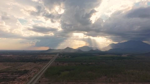 Sideways Aerial pullback of Ruta del Sol highway at sunset with dramatic sun Vídeos de archivo 331028410