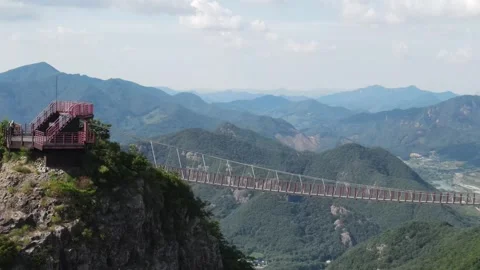 Sideways Aerial View Along Mountain Suspension Bridge at Gubongsan, Korea Stock Footage 343193503