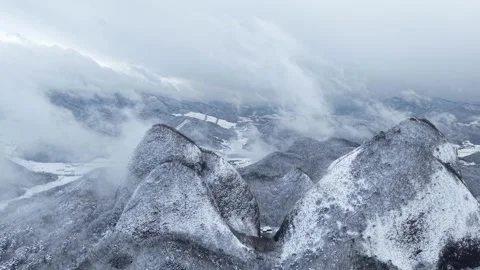Sideways Aerial View of Snow-Covered Mountain Peaks in Winter, South Korea Stock Footage 344248203