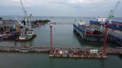 Sideways along huge deepwater dock container ship repairs SE Asia Stock Footage 141572661