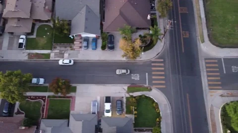 Sideways car tracking in neighborhood Stock Footage 164328343