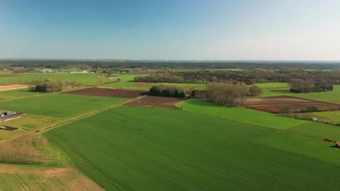 Sideways Drone Dolly Shot Over Rural Fields and Farm in Flanders Stock Footage 308938906