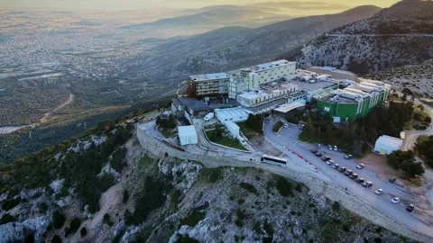 Sideways drone flight circles Regency Casino Mont Parnes, descending with Vídeo Stock 328998679