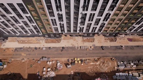 Sideways drone flight over construction site in Rafinad residential complex Stock Footage 329576652