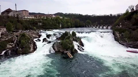 A sideways drone flight over the Rhine Falls Stock Footage 315753214