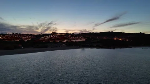 Sideways Drone Flight Over Sardinian Coastal Hotel and Sea at Sunset Vídeo Stock 334591967