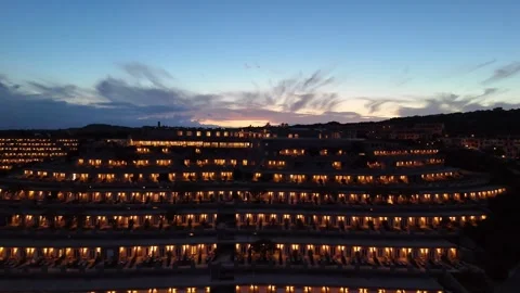 Sideways Drone Flight Over Sardinian Coastal Hotel and Sea at Sunset Stock Footage 334592163