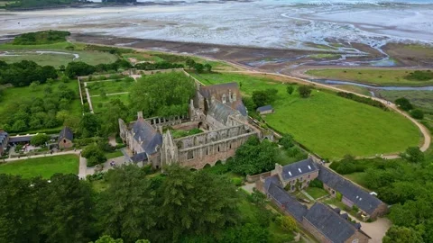 Sideways drone movement around the gothic Abbaye de Beauport historic abbey Stock Footage 311861773