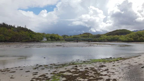 Sideways drone tracking shot across Morar Beach Видео 336170856