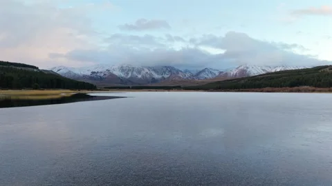 Sideways Drone Video Across Laguna La Zeta with Snowy Mountains Stock Footage 336776708