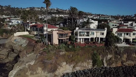 Sideways Drone video flight over ocean showing oceanfront property in La Jolla Stock Footage 84757921