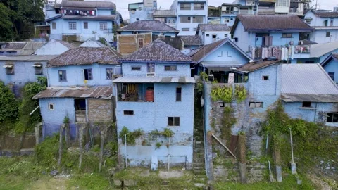 Sideways flight of the beautiful Blue Rainbow Village in Malang East Java 動画素材 295356902
