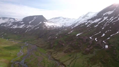 Sideways flying aerial over dramatic Icelandic landscape in summer. Mountains. Video stock 166445930