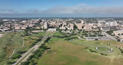 Sideways high flight viewing campus buildings and the bonfire memorial 스톡 동영상 335671398