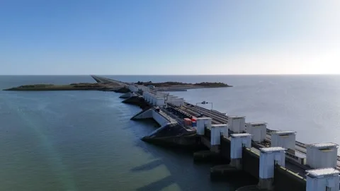 Sideways pass across lock works and distant dam line Stock Footage 331838860