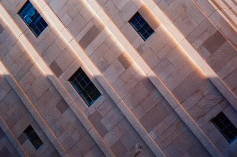 A sideways perspective of a building with windows Fotos de archivo