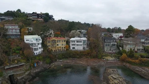 Sideways track drone of sea front houses Video stock 127002273