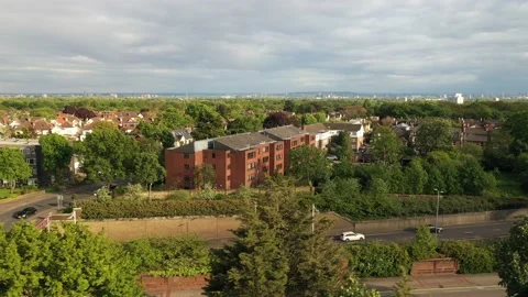 Sideways tracking footage of multilane road leading through neighbourhood Stock-Footage 155520842