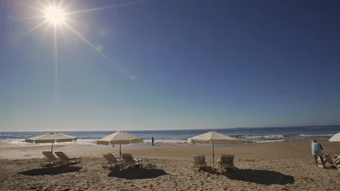 Sideways travelling at Punta del Este beach with beach umbrellas and Vídeo Stock 117401872