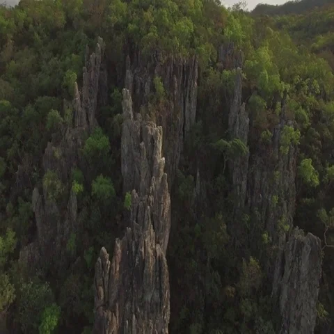 Sideways turn around rock formation in forest setting, Goiais, Brazil Stock Footage 69718202