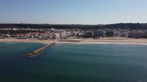 Sideways view to empty beaches in Caparica &amp; airplane in background, Portugal 4K Stock Footage 154458233