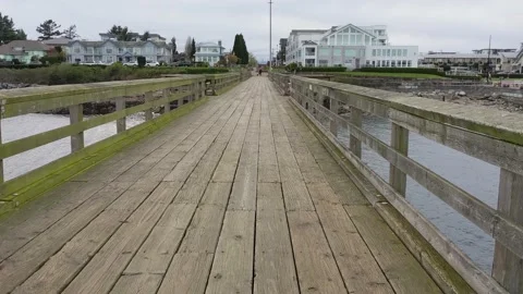 Sidney Pier walking back off Stock Footage 178307025