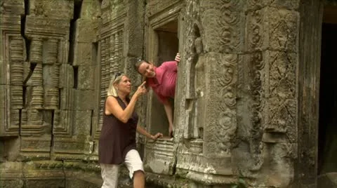 Siem reap cambodia mother and daughter tourists at temple ta prohm in angkor Stock Footage