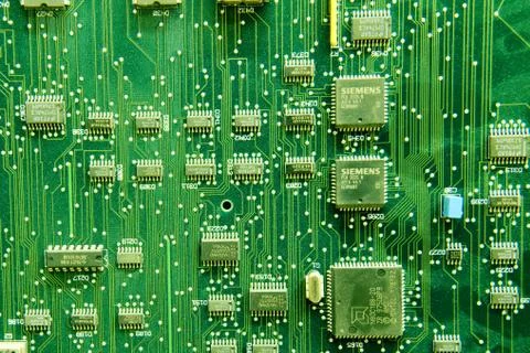 Siemens circuit pack, green computer board background. Telephone electronic c Stock Photos