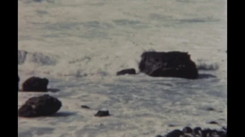 Sierra Leone 1950s, waves view of ocean with rock object in Freetown Stock Footage 299741586