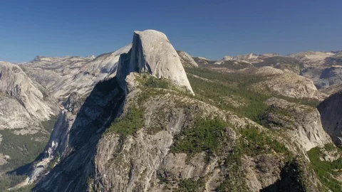 Sierra Nevada panoramic view with Half Dome cliff in the center. Yosemite Stock Footage
