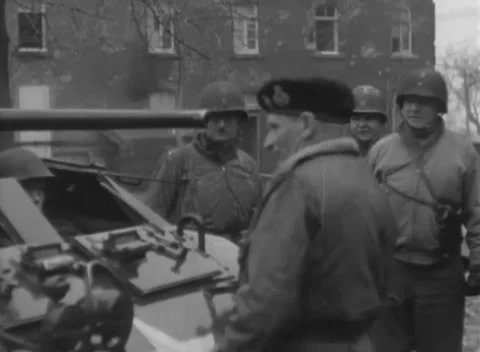 SIERSDORF - 1945: Command post visit - Allied personnel meet by jeep Stockbeeldmateriaal 343848727