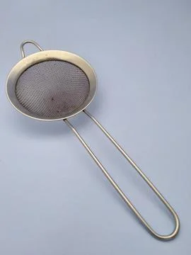Sieve with blue background 스톡 사진