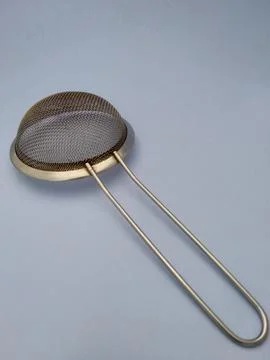 Sieve with blue background Stock Photos